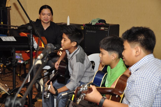 Teacher Jonathan with trio from Ateneo Grade School